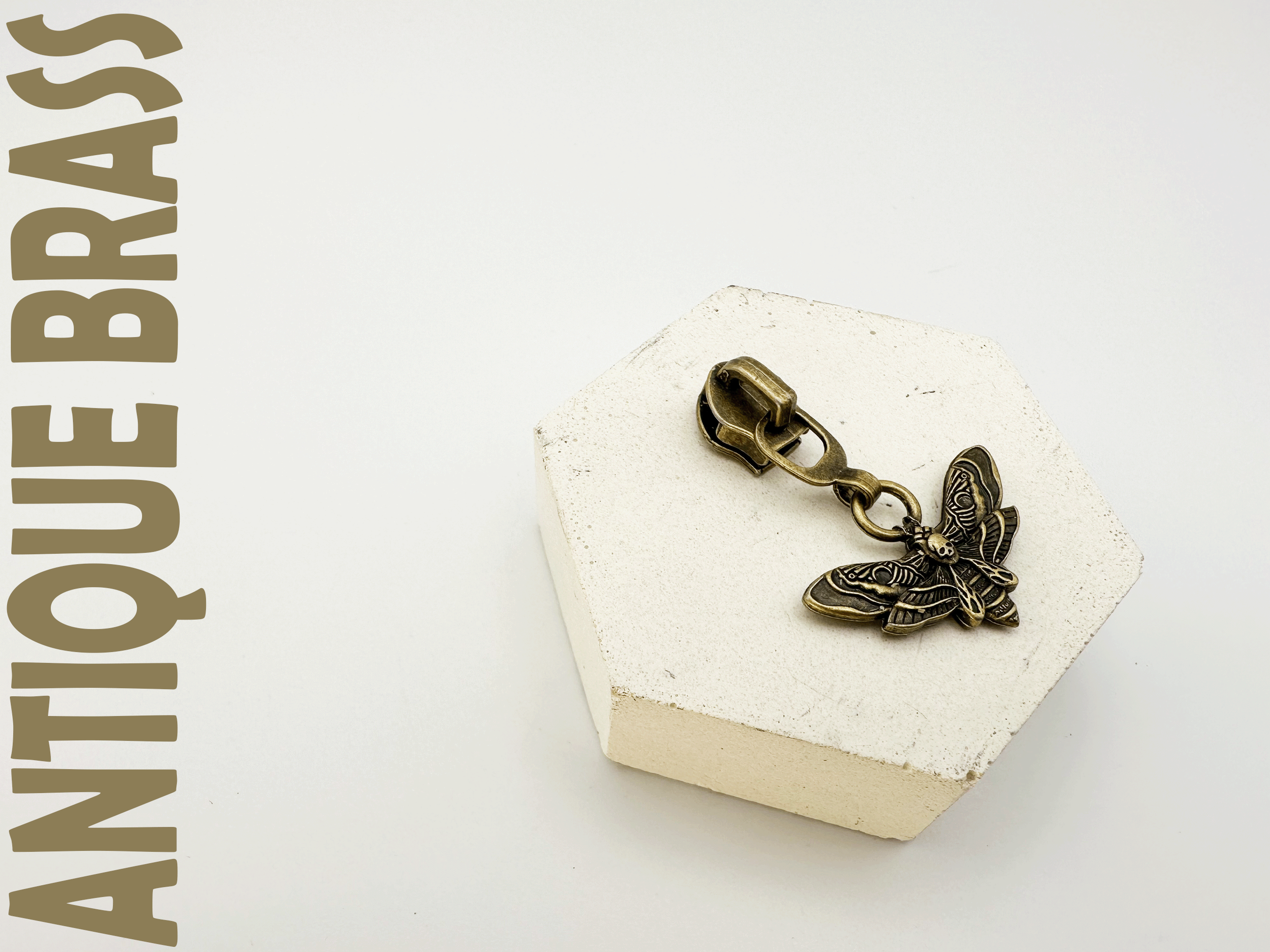 Double-sided Death Moth Zipper Pulls. Available in 4 finishes